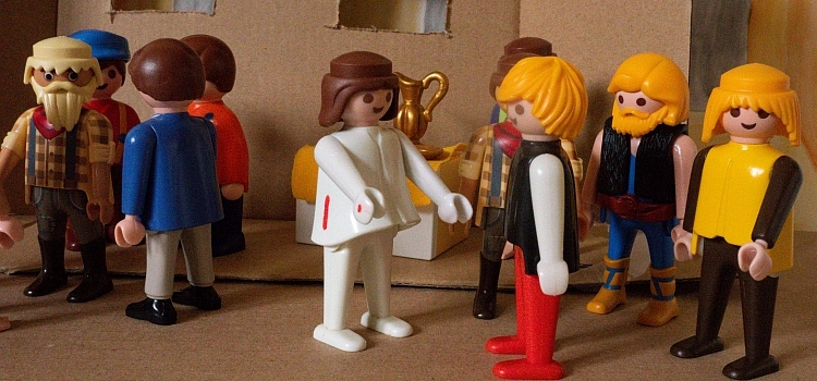 A Playmobil scene depicting Jesus standing before Thomas showing him his hands and side