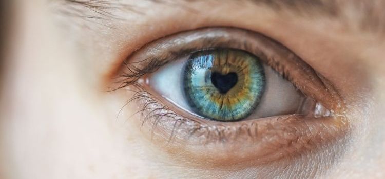 Close up of woman eye with heart shape pupil