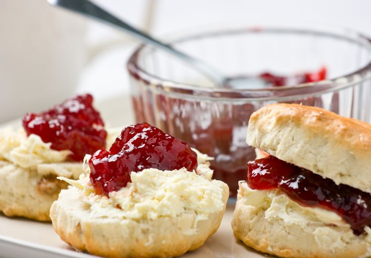 Home-baked scones tea with strawberry jam and clotted cream.