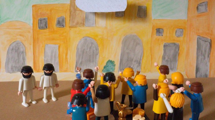 A Playmobil scene depicting the disciples standing around immediately following the ascension of Jesus