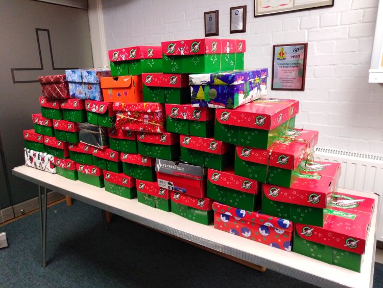 Operation Christmas Child shoeboxes stacked on a table