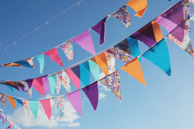 Summer festive colourful bunting and blue sky