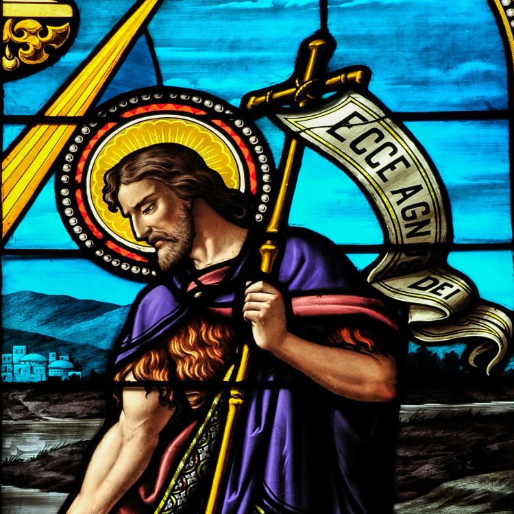 A stained glass window depicting John the Baptist