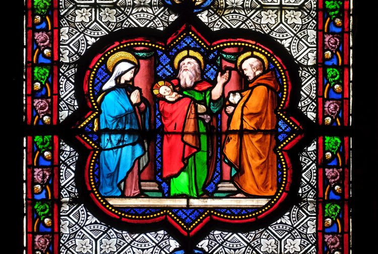 A stained glass window depicting Jesus's presentation in the temple