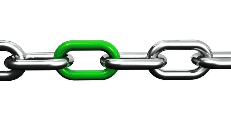 A steel chain with a green link