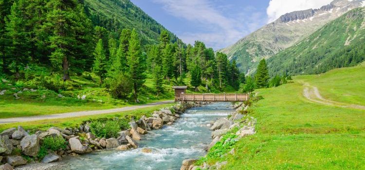 Mountain stream and the high peaks of the Austrian Alps